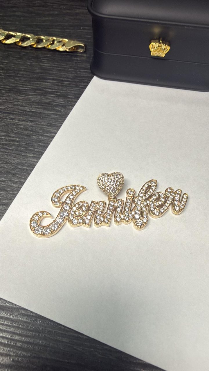 Custom script name pendant reading Jennifer, set with diamonds and a pavé heart bail
